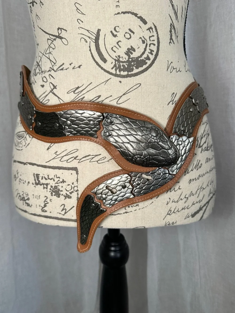 Vintage brown leather and silver colored metal articulated snake belt